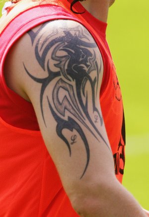 Im diggin the roman numerals on his arm, it seems like any footballer in 